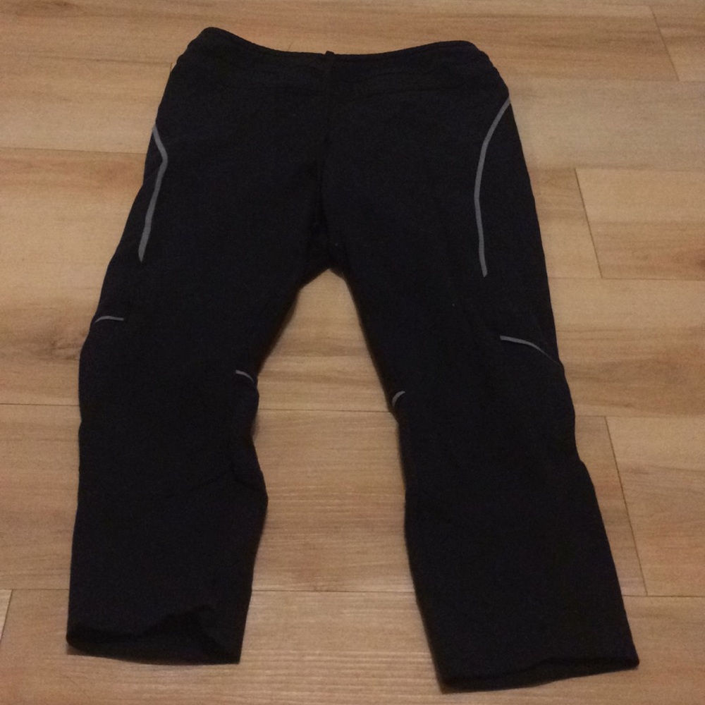 used black capris with reflective strips.